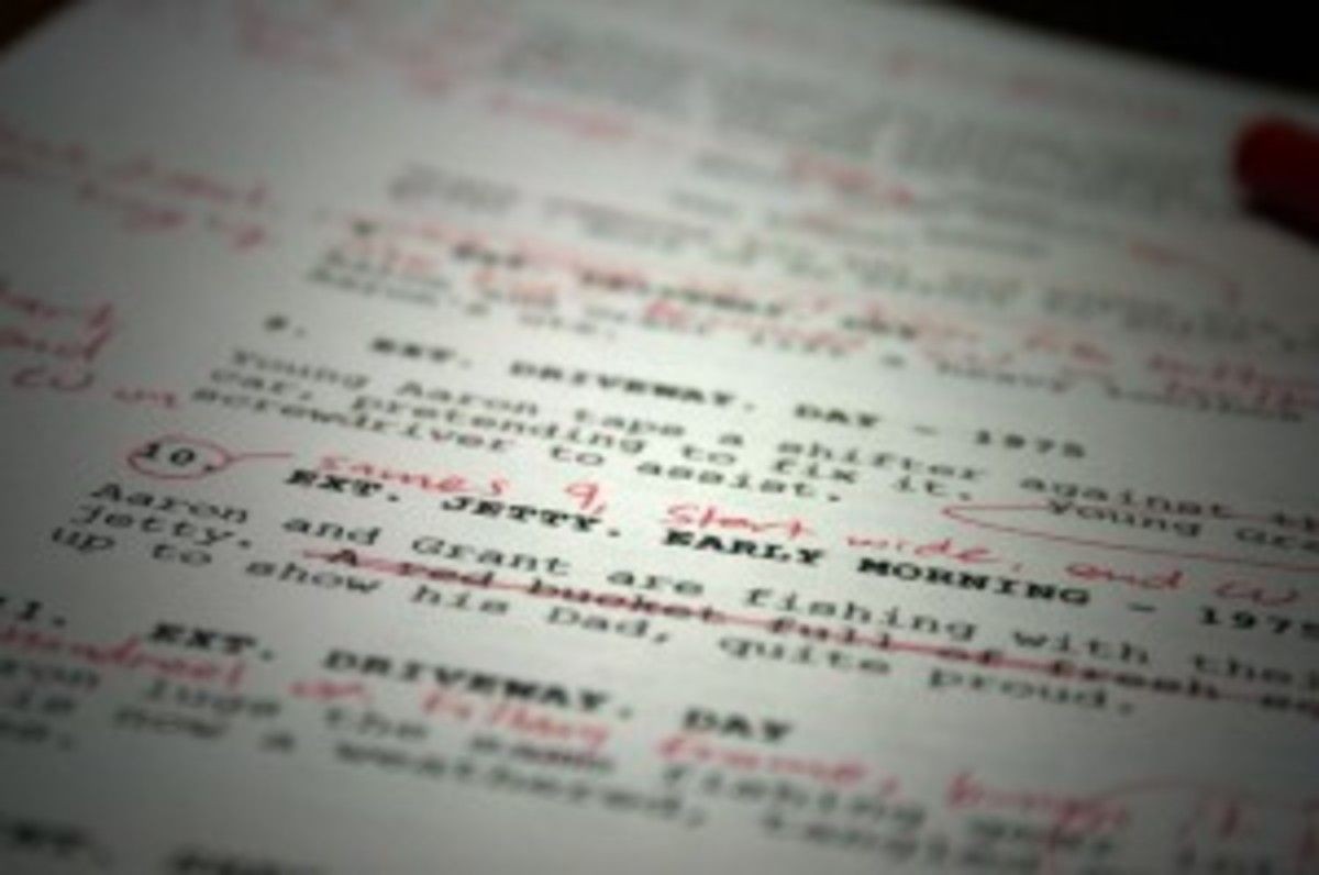 Close-up of a screenplay page with handwritten edits in red ink.